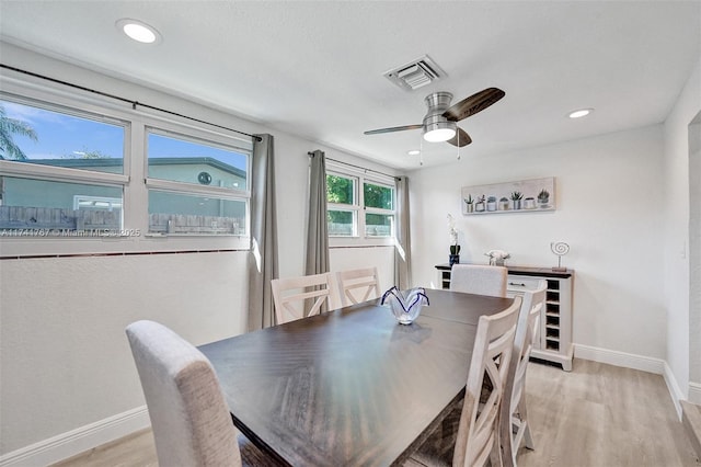 dining room featuring ceiling fan and light wood-type flooring