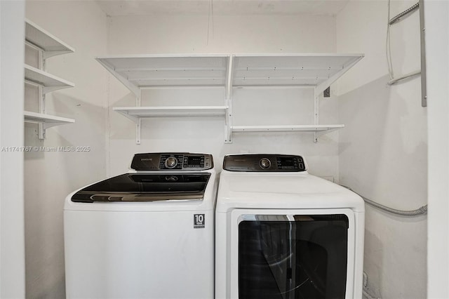 washroom with washer and dryer