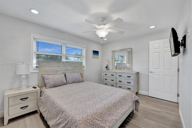 bedroom featuring light hardwood / wood-style floors and ceiling fan