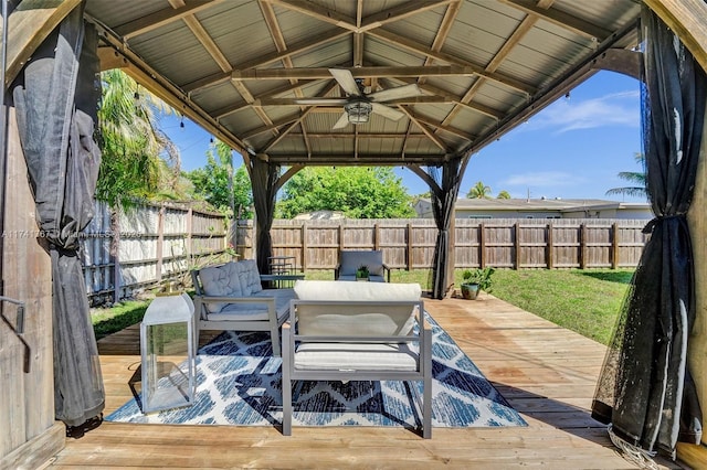 view of patio with a wooden deck, a gazebo, and ceiling fan