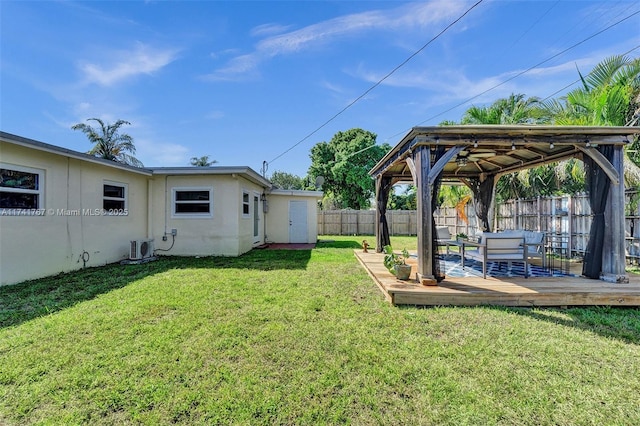 view of yard featuring a wooden deck and a gazebo