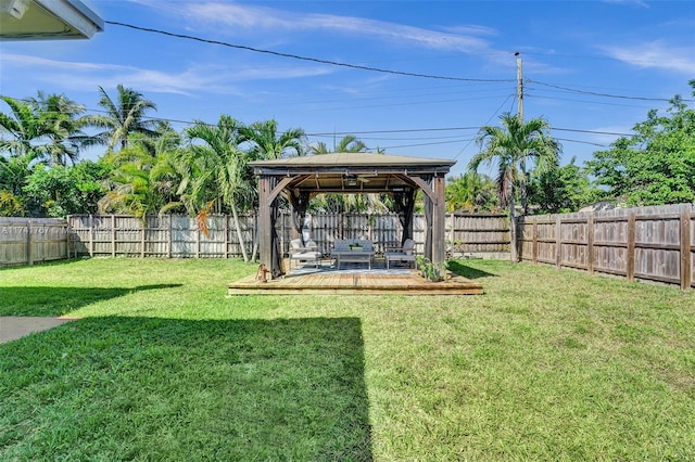 view of yard featuring a gazebo and a wooden deck