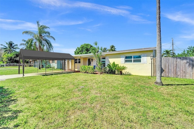 single story home with a carport and a front yard