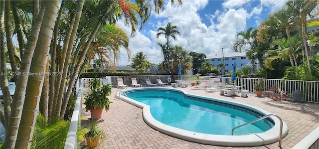 view of swimming pool featuring a patio