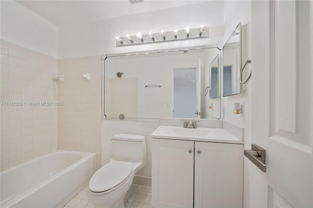 full bathroom featuring vanity, tiled shower / bath combo, tile patterned floors, and toilet