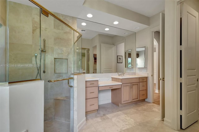 full bathroom featuring a stall shower, recessed lighting, and vanity