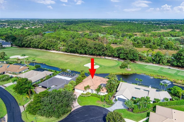 bird's eye view featuring view of golf course, a water view, and a residential view