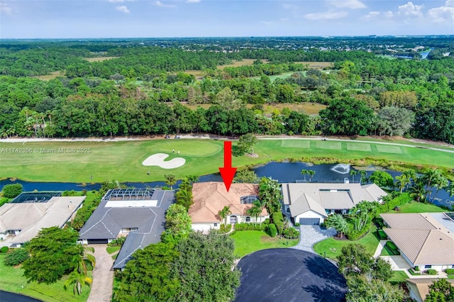 birds eye view of property featuring a water view, a residential view, and golf course view