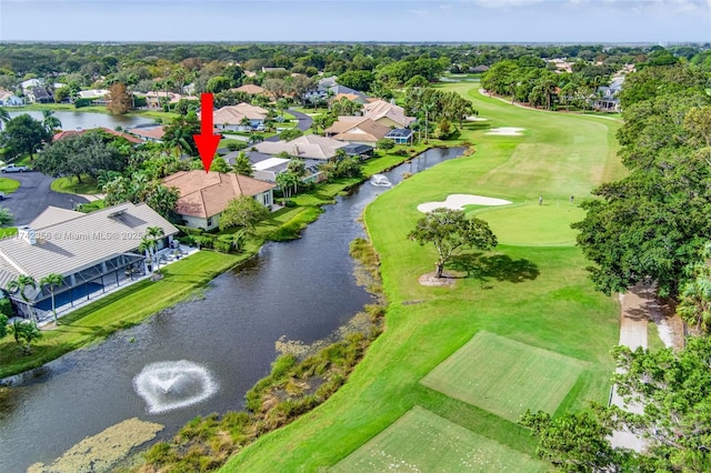 bird's eye view with view of golf course and a water view