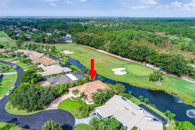 bird's eye view featuring a residential view, view of golf course, and a water view