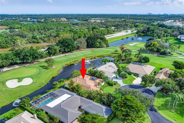 drone / aerial view featuring a water view, a residential view, and golf course view