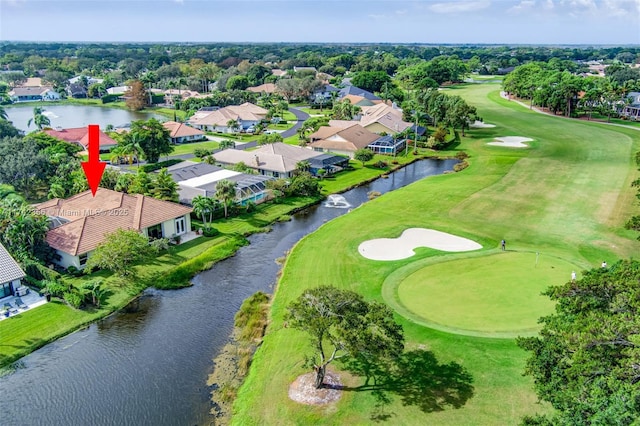 bird's eye view featuring a residential view, view of golf course, and a water view