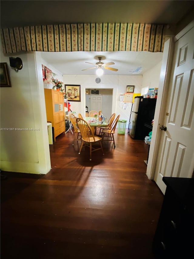 dining room featuring dark hardwood / wood-style floors and ceiling fan