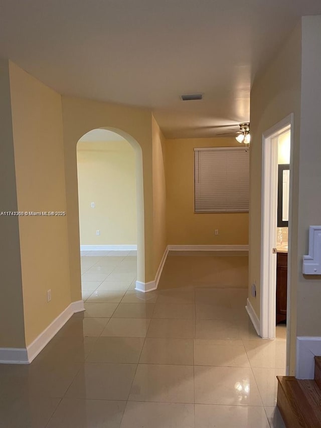 corridor featuring light tile patterned floors