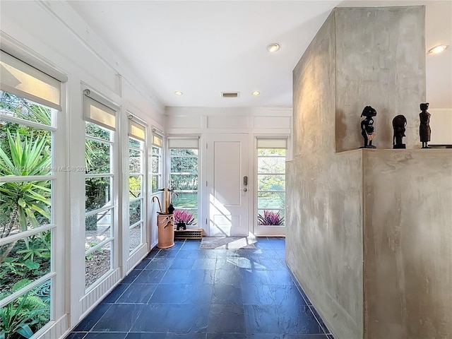 interior space featuring visible vents, recessed lighting, and stone tile floors