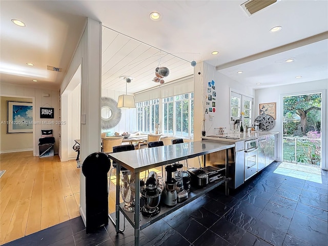 interior space with a sink, visible vents, and recessed lighting