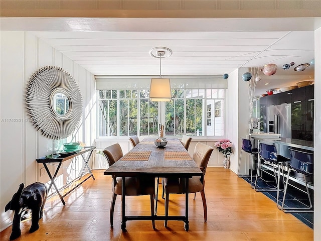 dining area featuring wood-type flooring