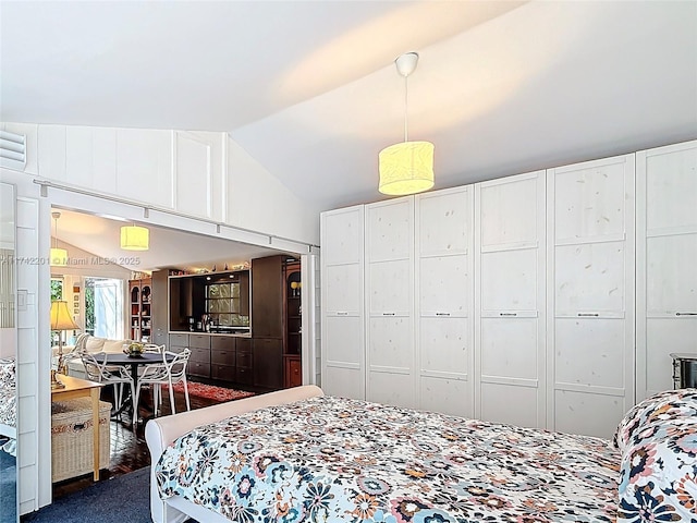 bedroom featuring lofted ceiling