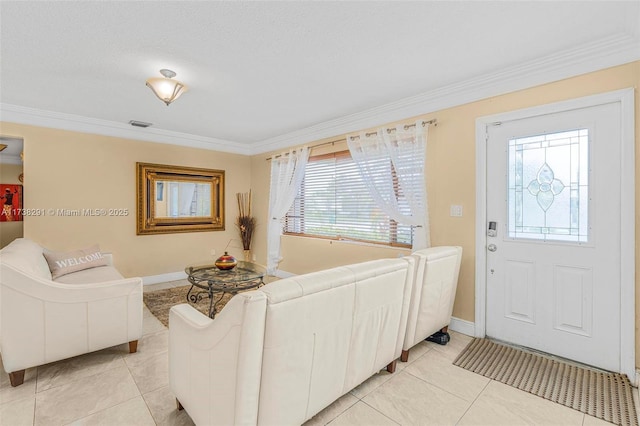 living room featuring ornamental molding and light tile patterned flooring