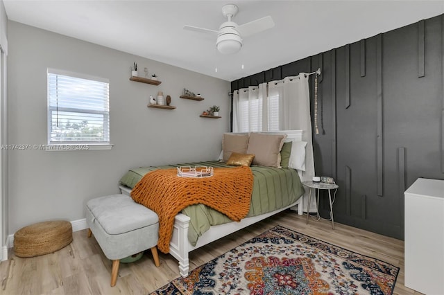 bedroom with ceiling fan and light hardwood / wood-style floors