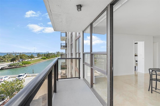 balcony featuring a water view