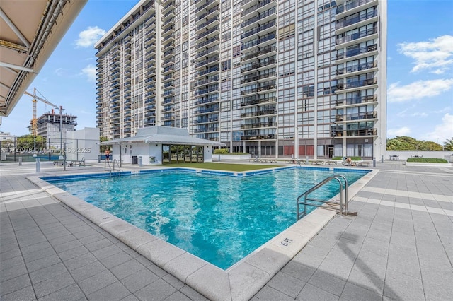 view of swimming pool with a patio