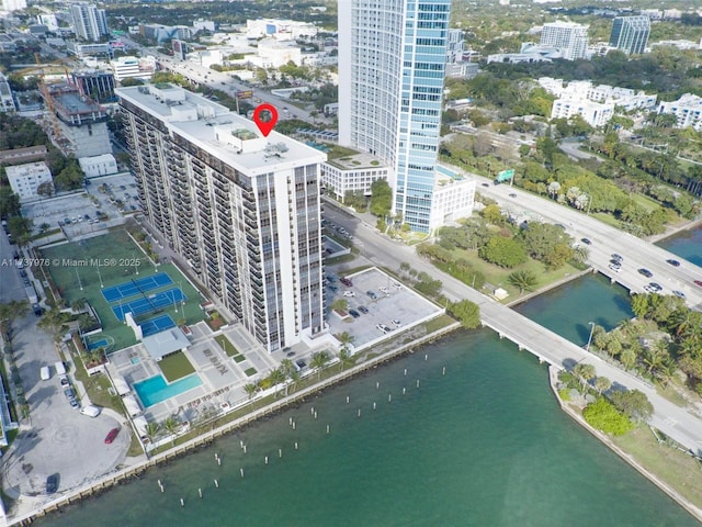 birds eye view of property with a water view