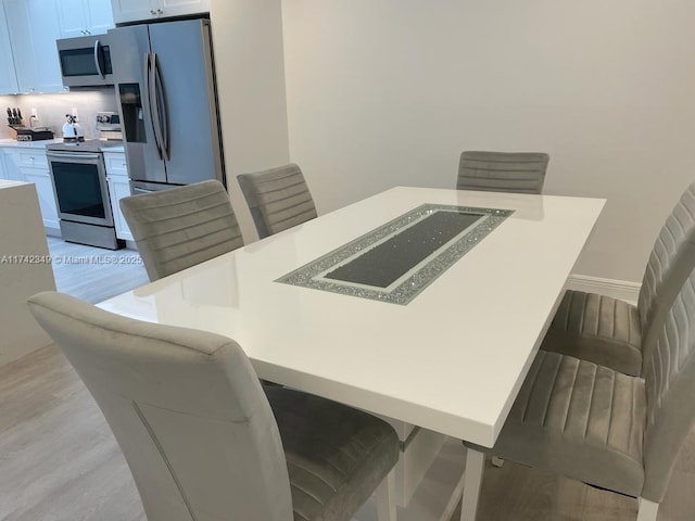 dining room featuring light hardwood / wood-style flooring