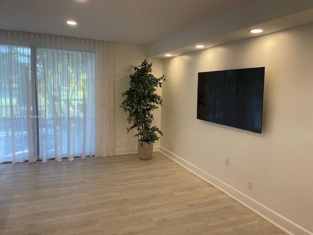 unfurnished room with wood-type flooring