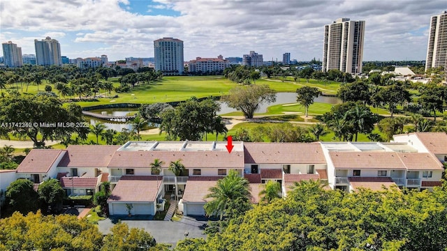 birds eye view of property with a water view