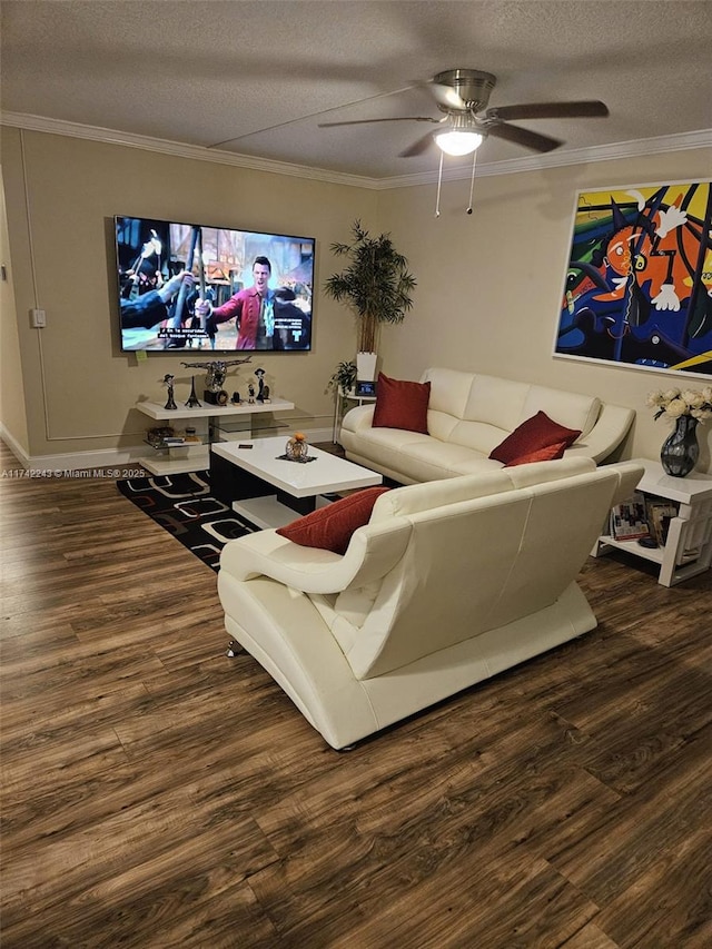 living room with dark wood-type flooring, ornamental molding, and a textured ceiling