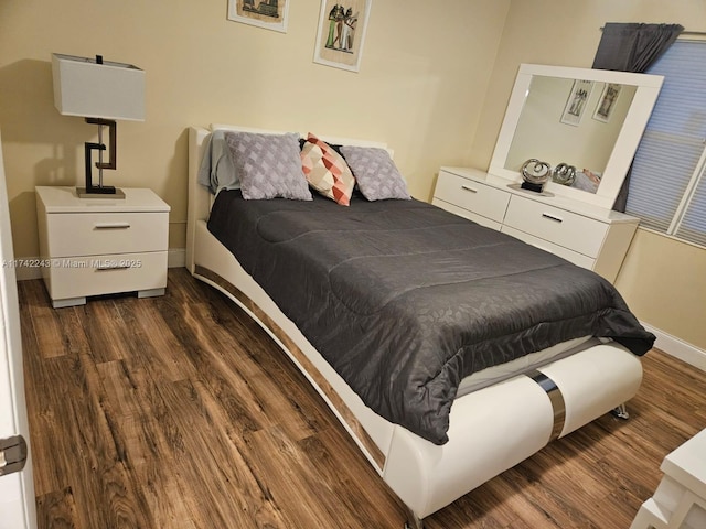 bedroom featuring dark hardwood / wood-style floors