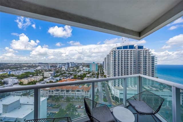 balcony featuring a water view