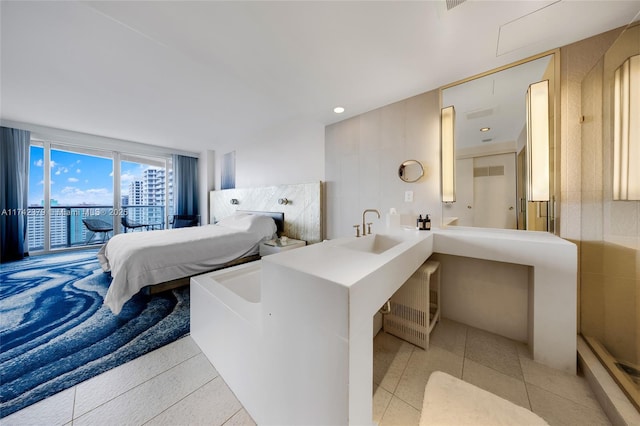 bathroom with tile patterned flooring and sink