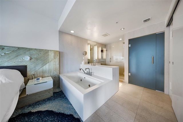 bathroom featuring tile patterned flooring and tile walls