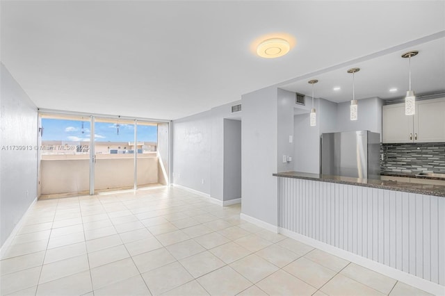 spare room with light tile patterned floors