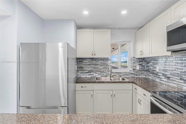 kitchen with white cabinetry, sink, and appliances with stainless steel finishes