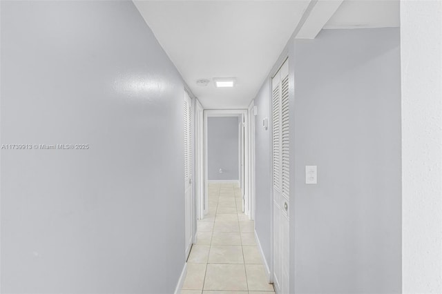 corridor with light tile patterned floors