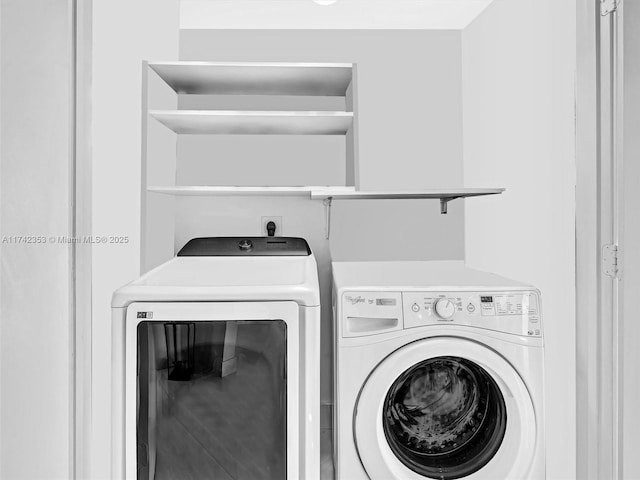 laundry room with washer and dryer