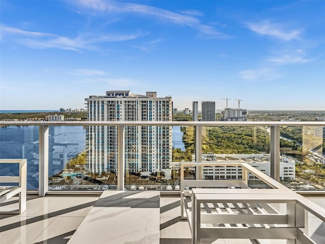 balcony featuring a water view