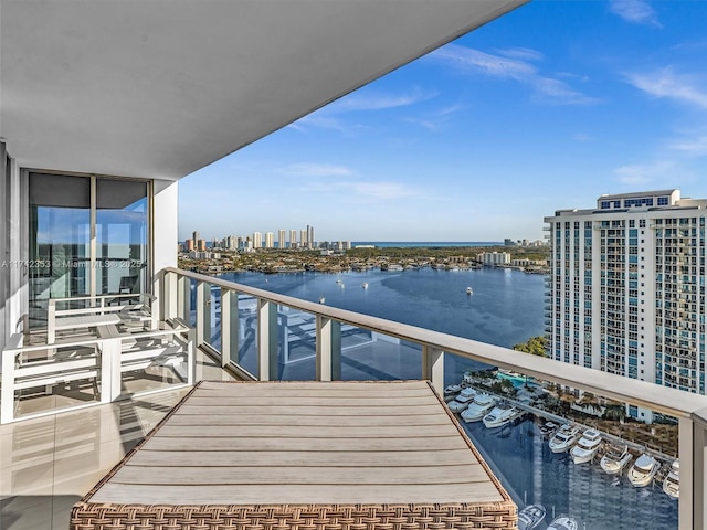 balcony featuring a water view