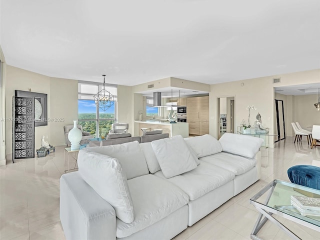 living room with an inviting chandelier