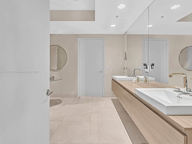 bathroom with vanity and tile patterned flooring