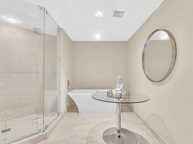 bathroom featuring separate shower and tub and tile patterned flooring