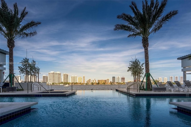 view of pool featuring a water view