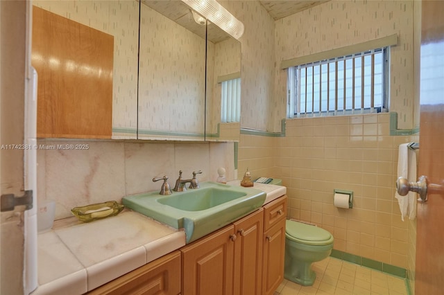 bathroom with tile patterned floors, vanity, and toilet