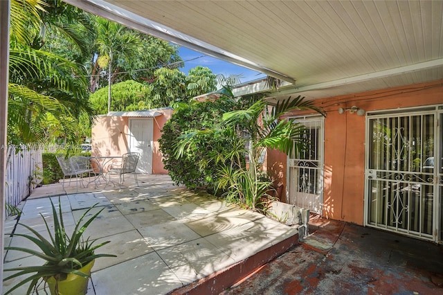 view of patio / terrace featuring a shed