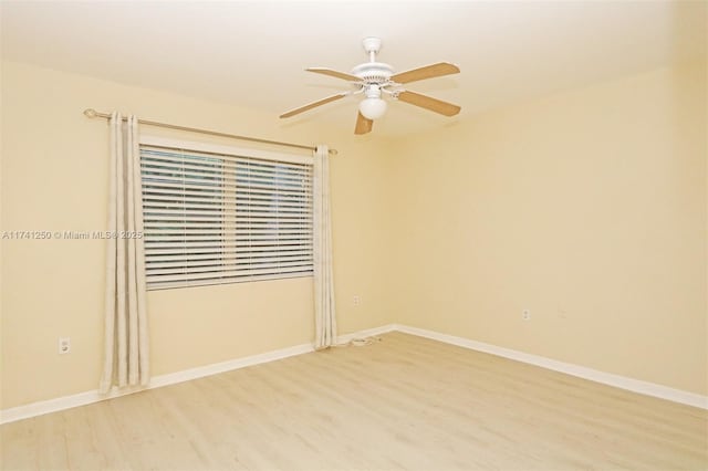 spare room featuring ceiling fan and hardwood / wood-style floors