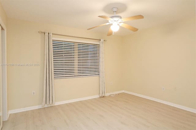 empty room featuring ceiling fan and light hardwood / wood-style floors