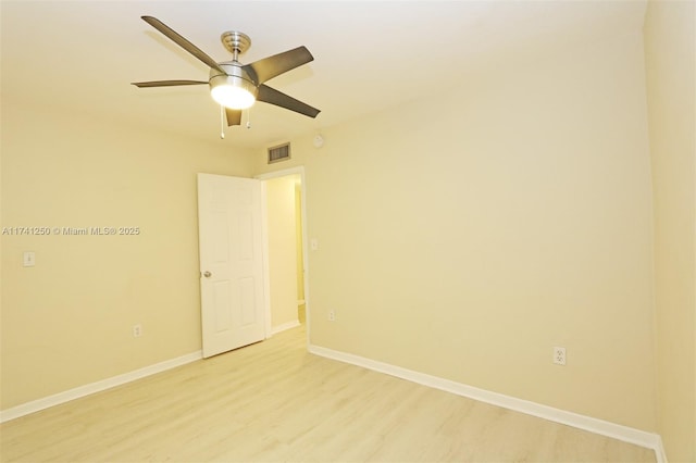 spare room with light hardwood / wood-style flooring and ceiling fan